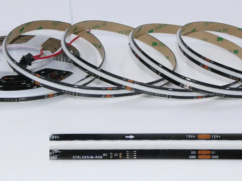Unlit addressable COB LED strip coils with a continuous phosphor band