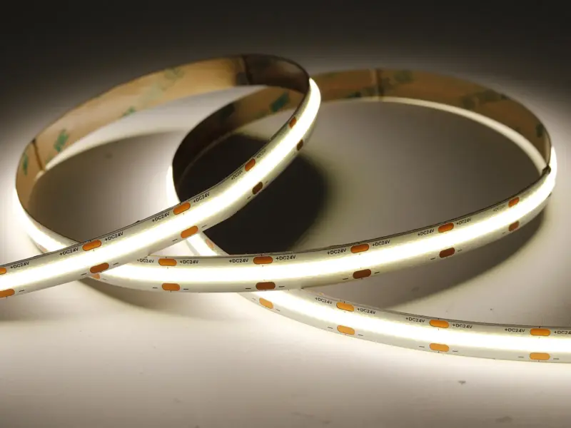 High-density COB LED strip lit in a coil producing one seamless dot-free band