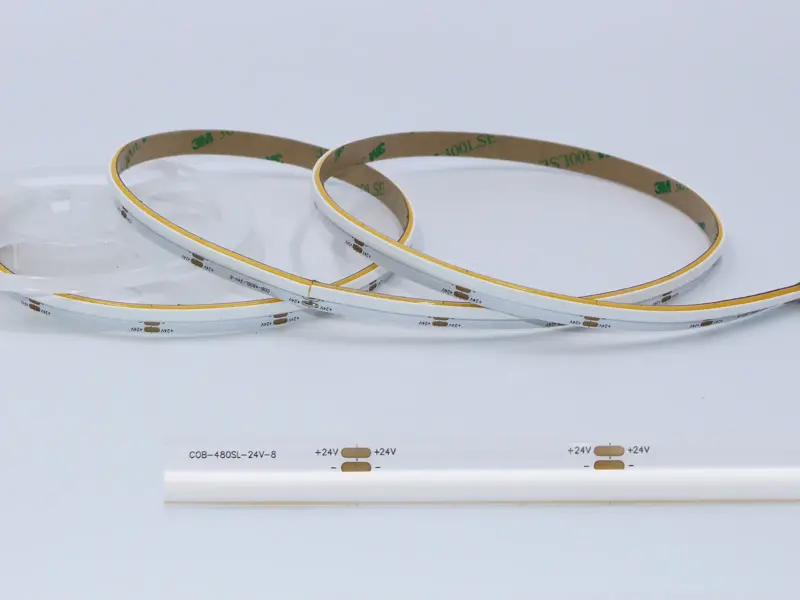 Side-view COB LED strip coil emitting a continuous line of light from its edge