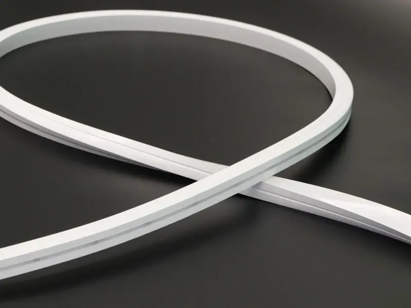 White 3D bend LED neon flex looped freely against a black background