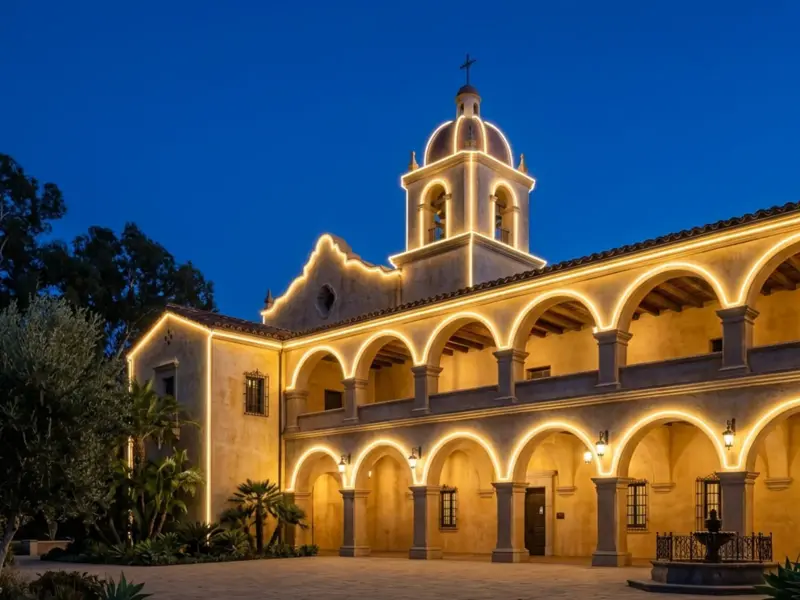 Arched building facade at dusk outlined by smooth LED neon flex curves