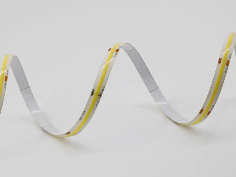 IP65 rated LED strip bent to show its conformal coating over the chips