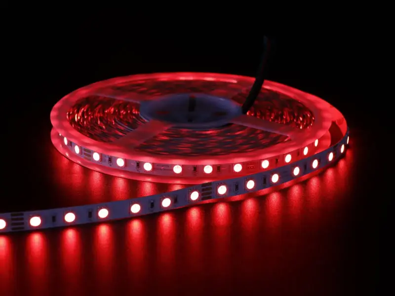 Lit 5050 SMD LED strip coil in red showing its large high-output chips