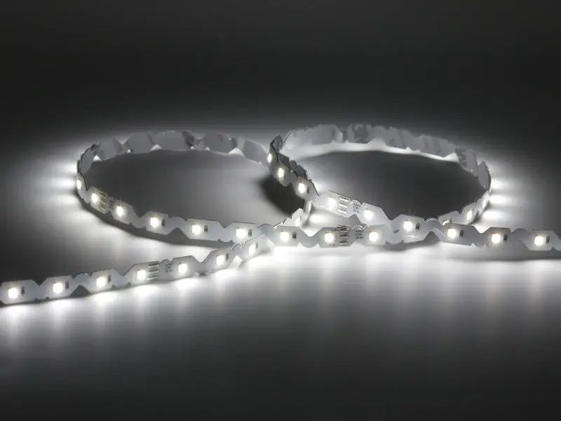 Flexible S-shape SMD LED strip bent into tight curves showing its zigzag PCB
