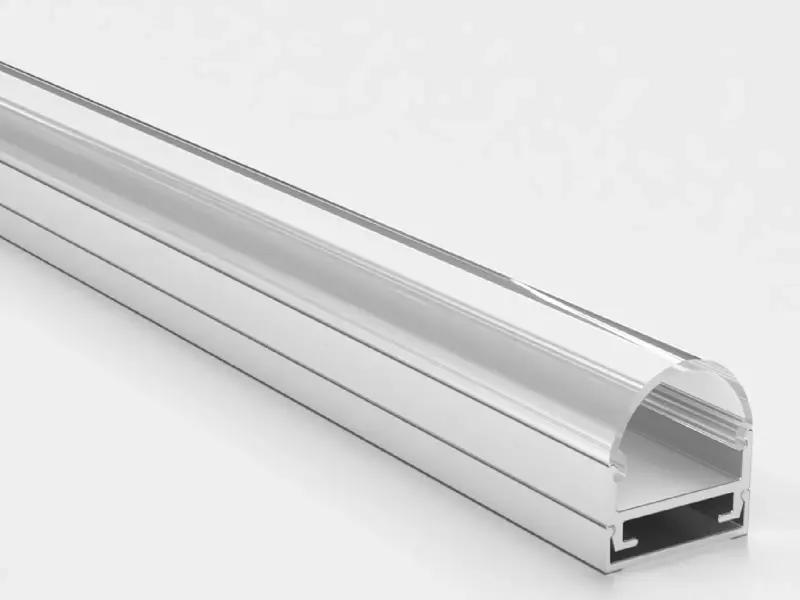 Surface-mount aluminum LED channel with clear rounded cover, angled end view showing the mounting slots underneath