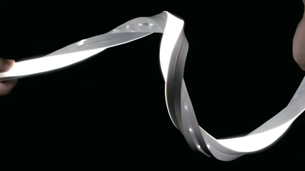 UT-N1616-3D neon flex glowing white, twisted into an open loop against a black background to show it bending in two directions