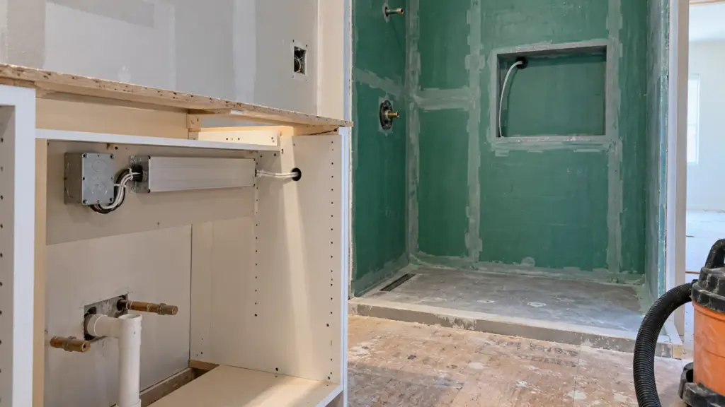 Class 2 LED driver mounted in a vanity base, with the cable run to a shower niche at rough-in