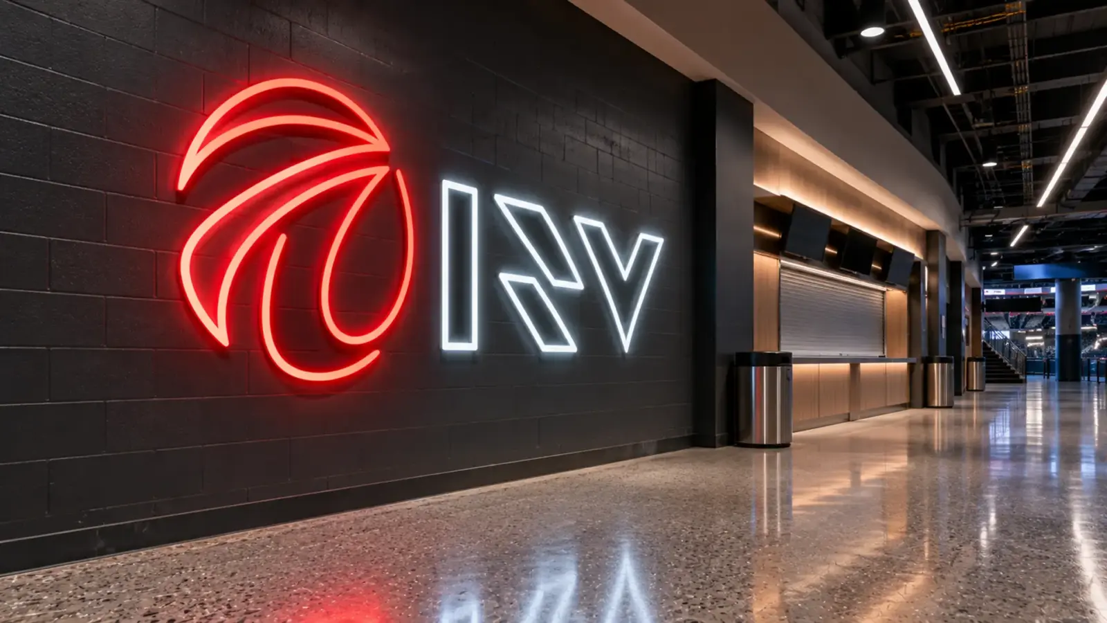 Sports arena concourse wall with a red and white LED neon flex logo and lettering